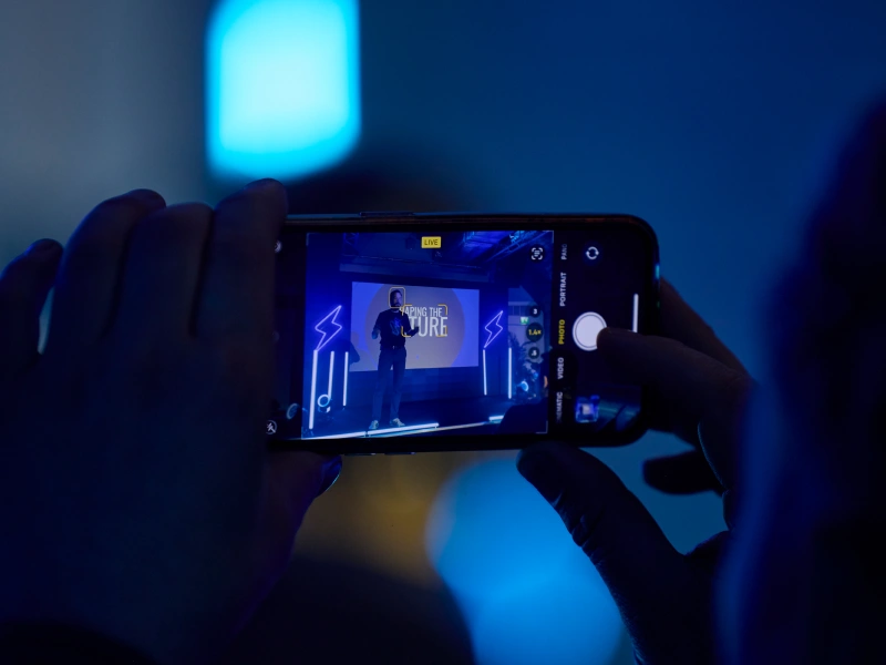 Looking at a person's phone who is recording the keynote speaker at Conversion.