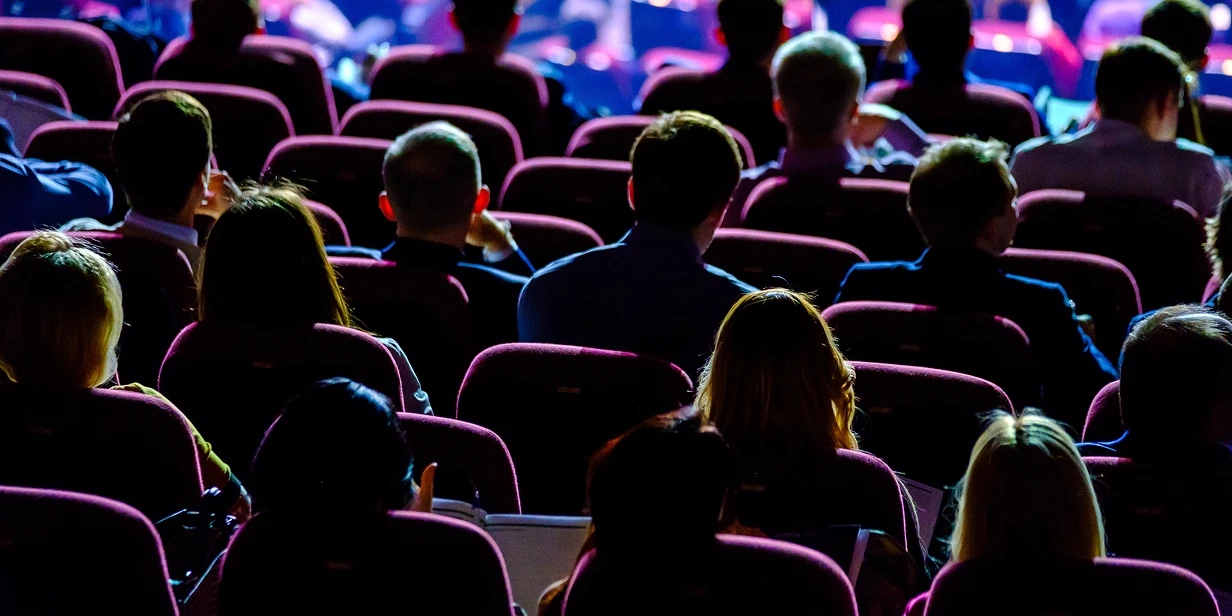 Audience of professionals in seats at an event
