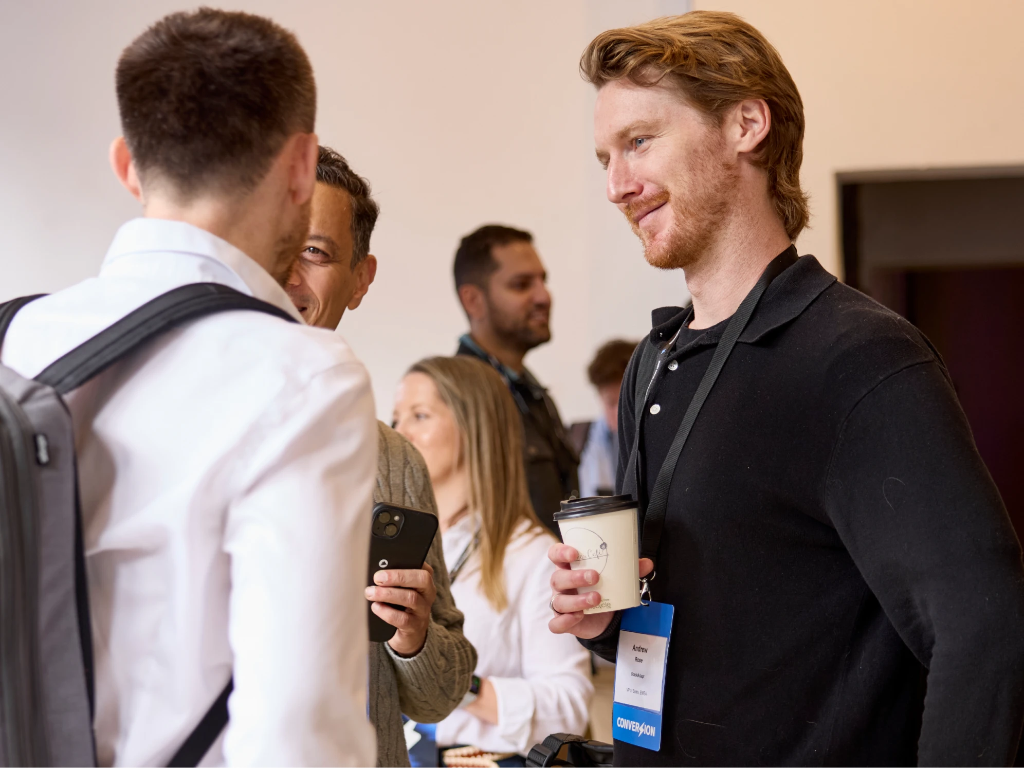 Event attendees having a conversation. 