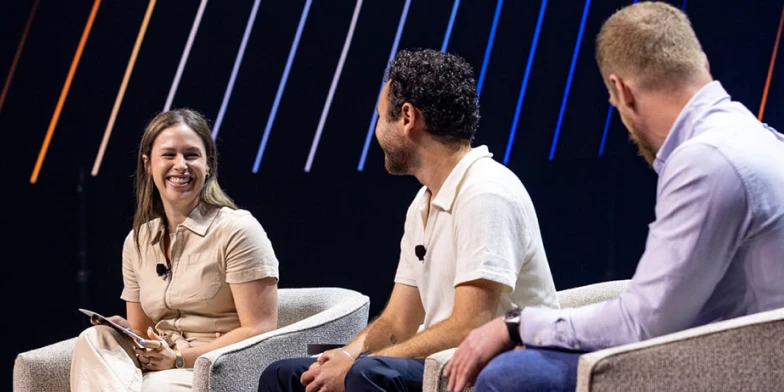 Marketing leaders participating in a fireside chat on stage at Conversion 2026, discussing how to connect live events to broader marketing strategy and business impact.