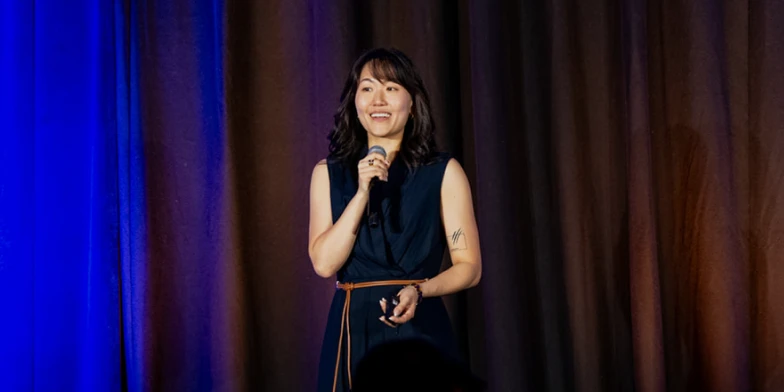 June Sung, VP of Global Analytics & Insights at StackAdapt, speaking on stage about measurement, analytics, and performance insights at Conversion 2026.