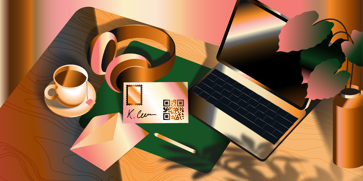 Workspace with a laptop, coffee cup, envelope, pencil, and mail card with a QR code.