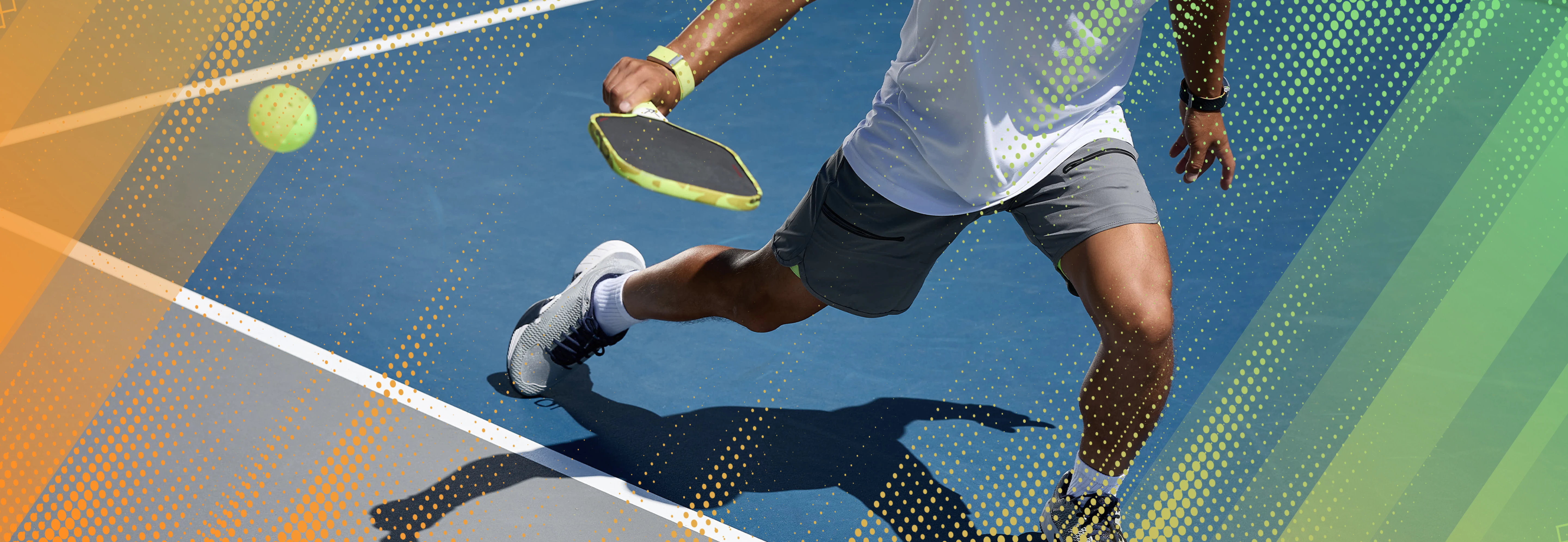 A person plays pickleball on a court.