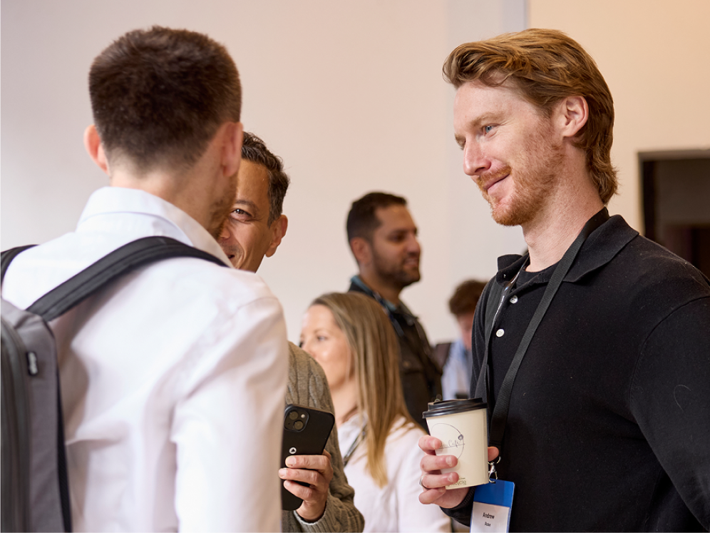People at a conference talking to each other