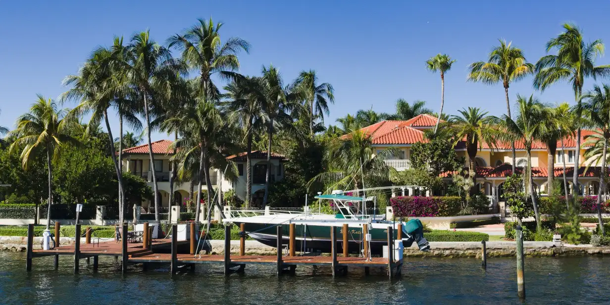 A sunny waterfront scene in Fort Lauderdale showing a boat docked